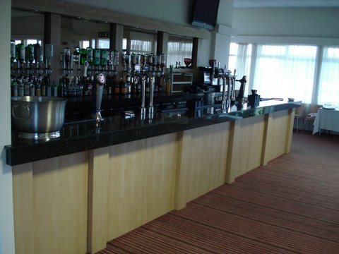Bar counter with timber panelled front