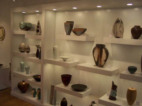 Floating display shelves for a ceramics gallery