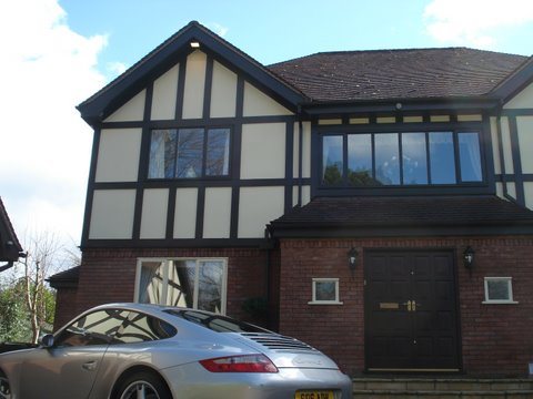 Front elevation of a decorated Tudor style home