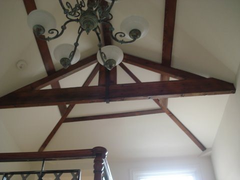 Vaulted ceiling with stained timber trusses