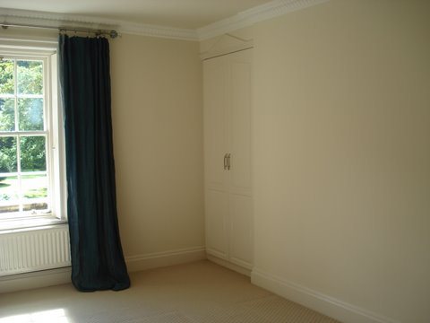 Freshly decorated bedroom with sash window
