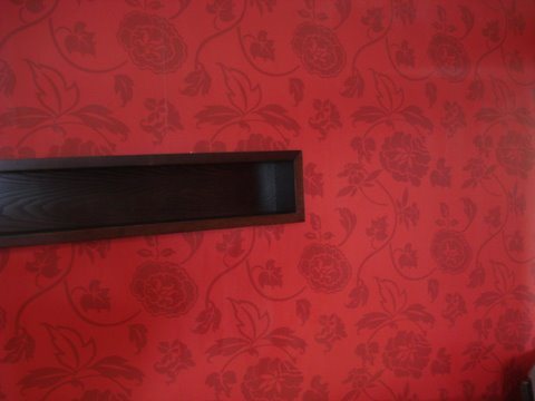 Red damask feature wallpaper